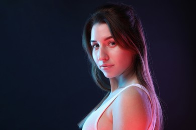 Portrait of beautiful young woman on color background, space for text