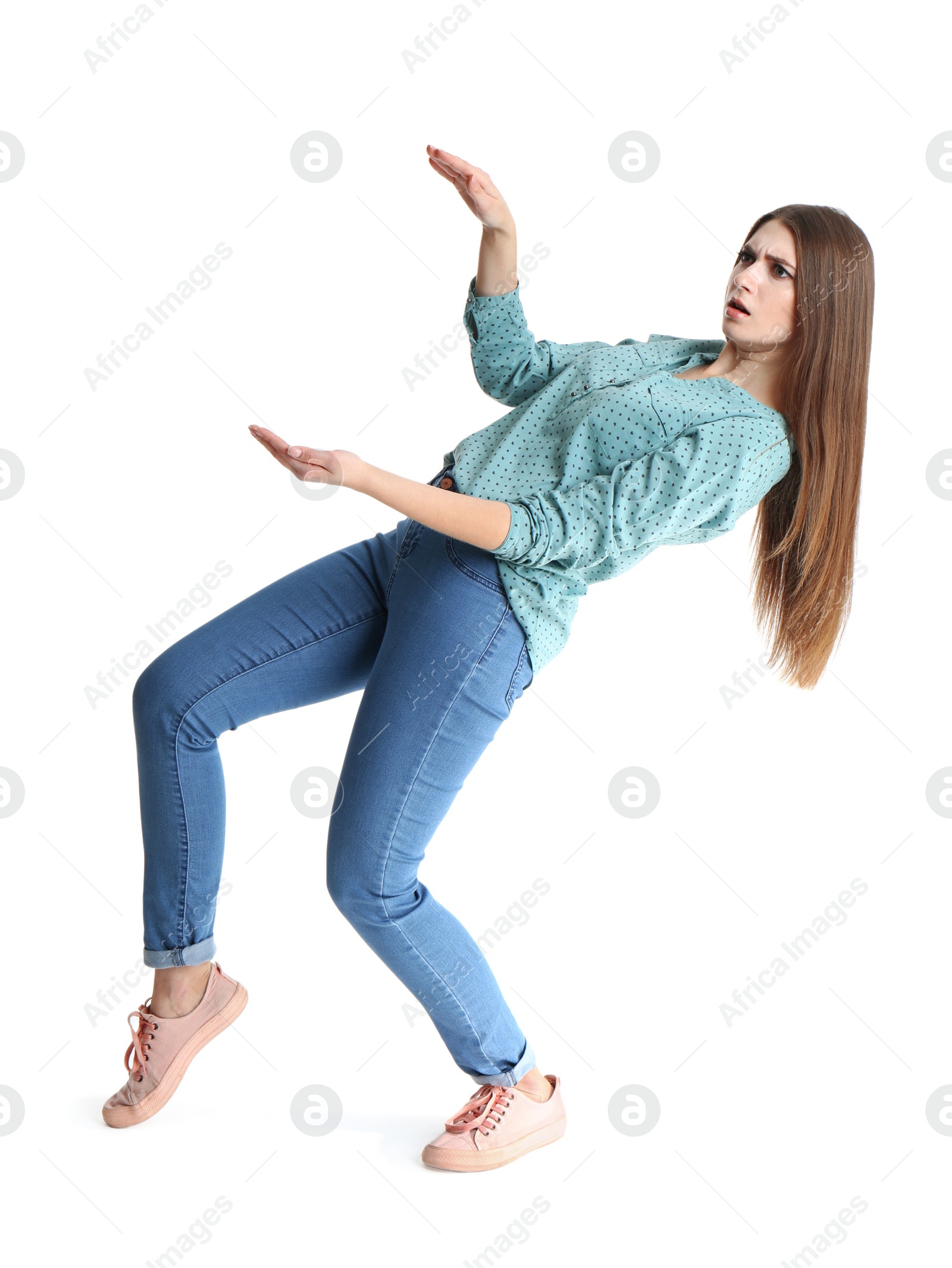 Photo of Young woman with magnet attracting people on white background