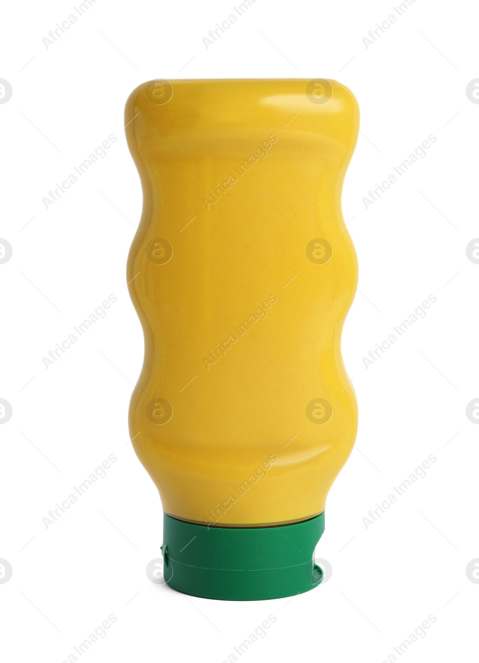 Photo of Spicy mustard in plastic bottle isolated on white