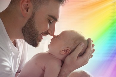 Image of National rainbow baby day. Father with his cute little child, closeup