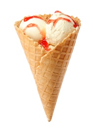 Photo of Delicious ice cream with topping in waffle cone on white background