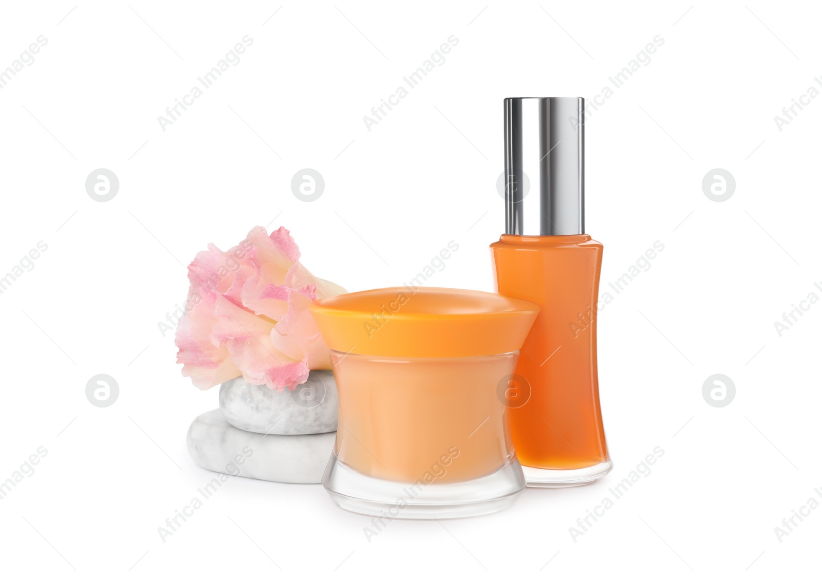 Photo of Cosmetic products, flower and spa stones on white background