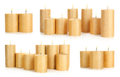 Set of burning gold candles on white background