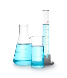 Different laboratory glassware with light blue liquid isolated on white