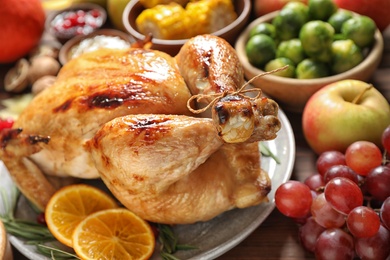 Delicious turkey, autumn vegetables and fruits as background, closeup. Happy Thanksgiving day