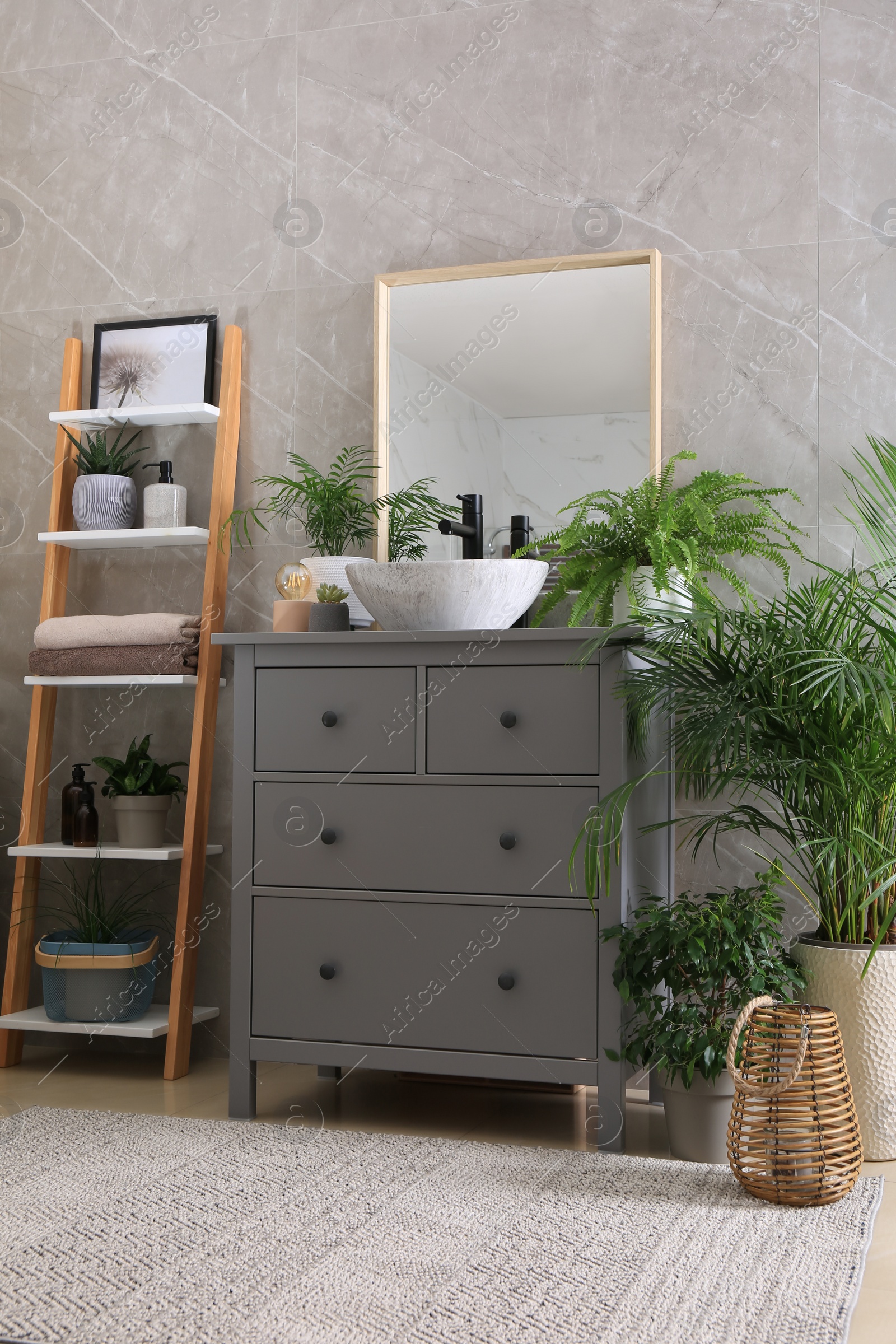 Photo of Modern bathroom interior with stylish vessel sink and beautiful green houseplants