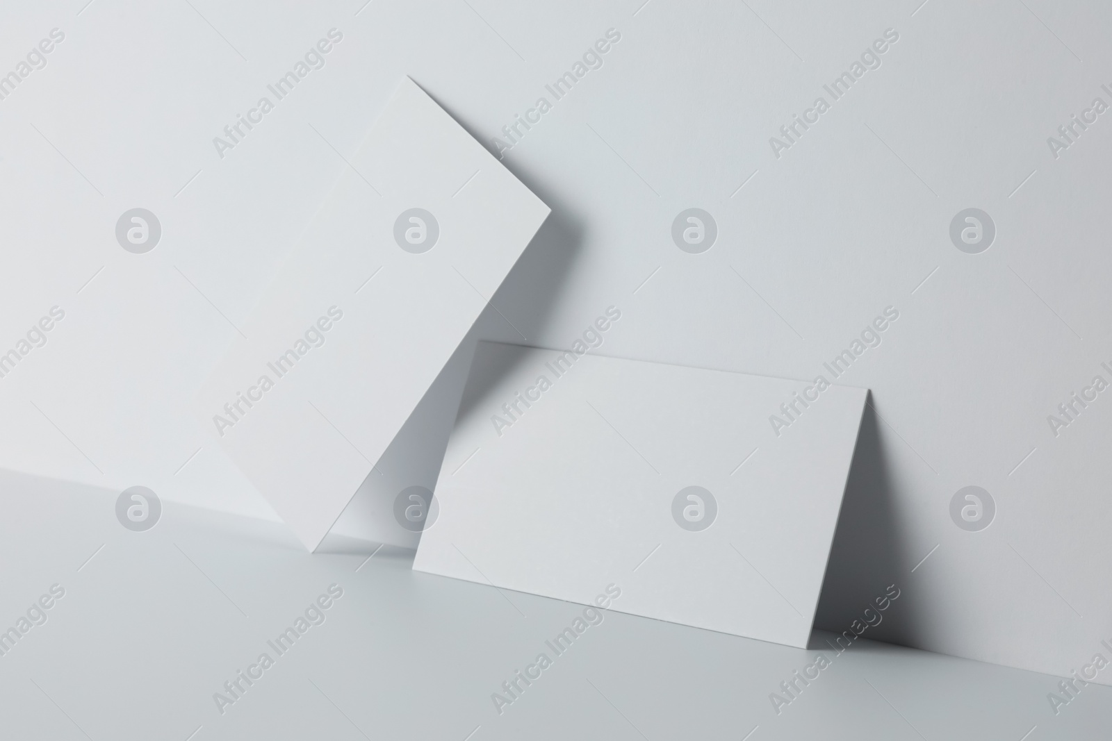 Photo of Blank business cards on white background. Mockup for design