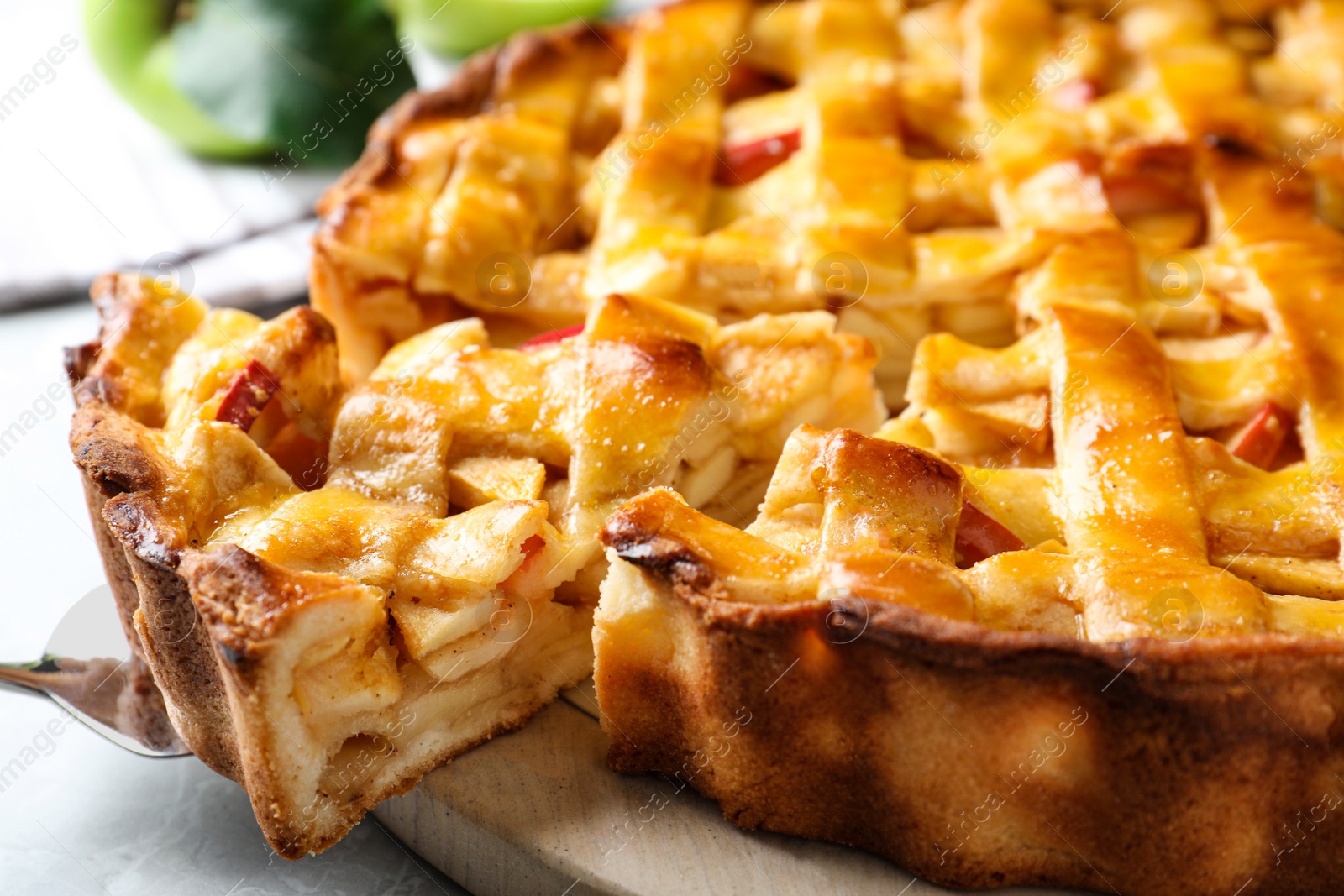 Photo of Fresh traditional apple pie on table, closeup