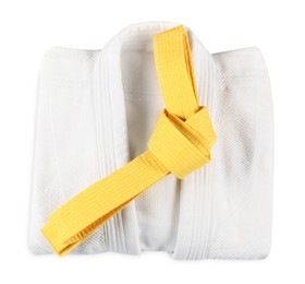 Photo of Martial arts uniform with yellow belt isolated on white, top view