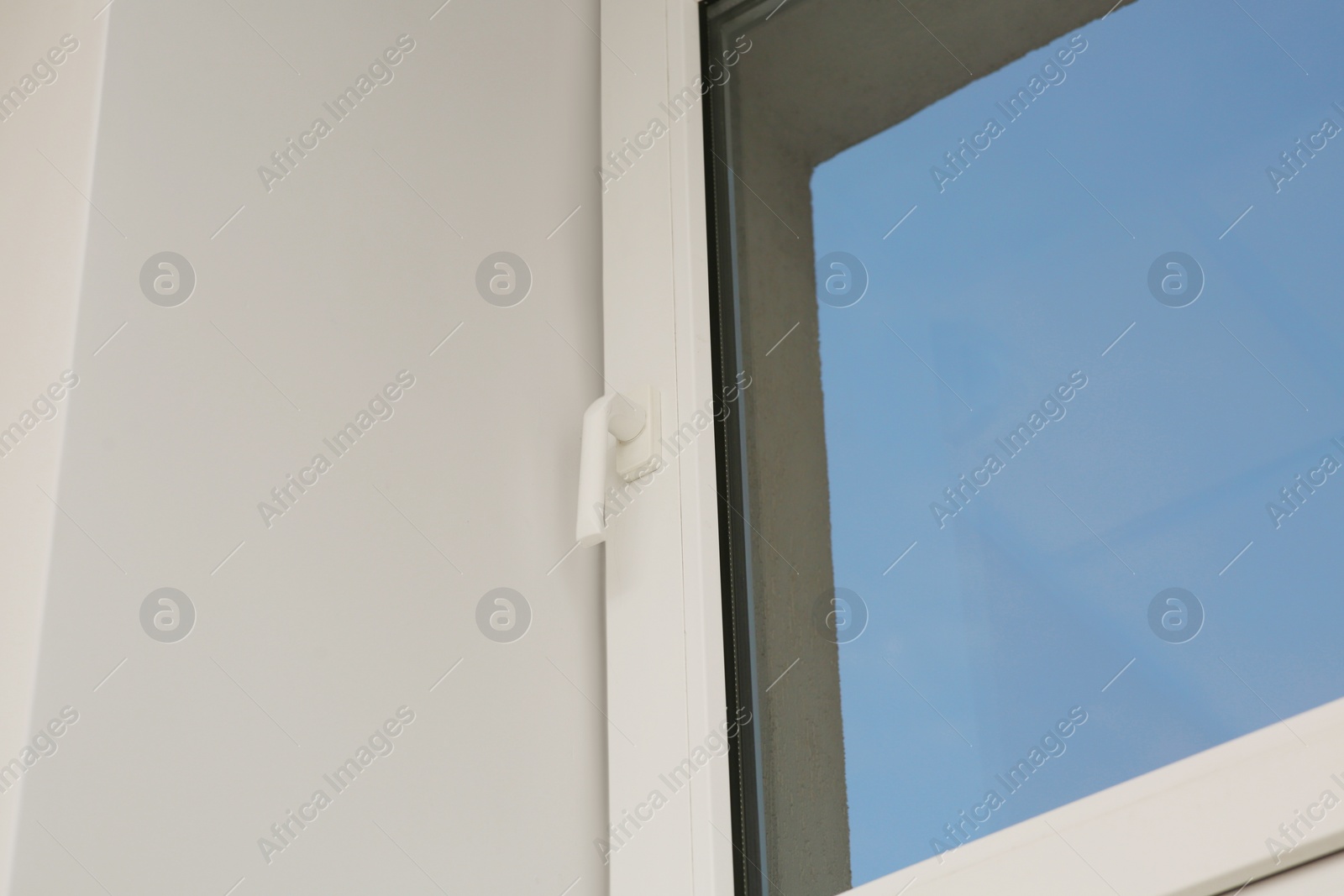 Photo of Glass plastic window near white wall indoors