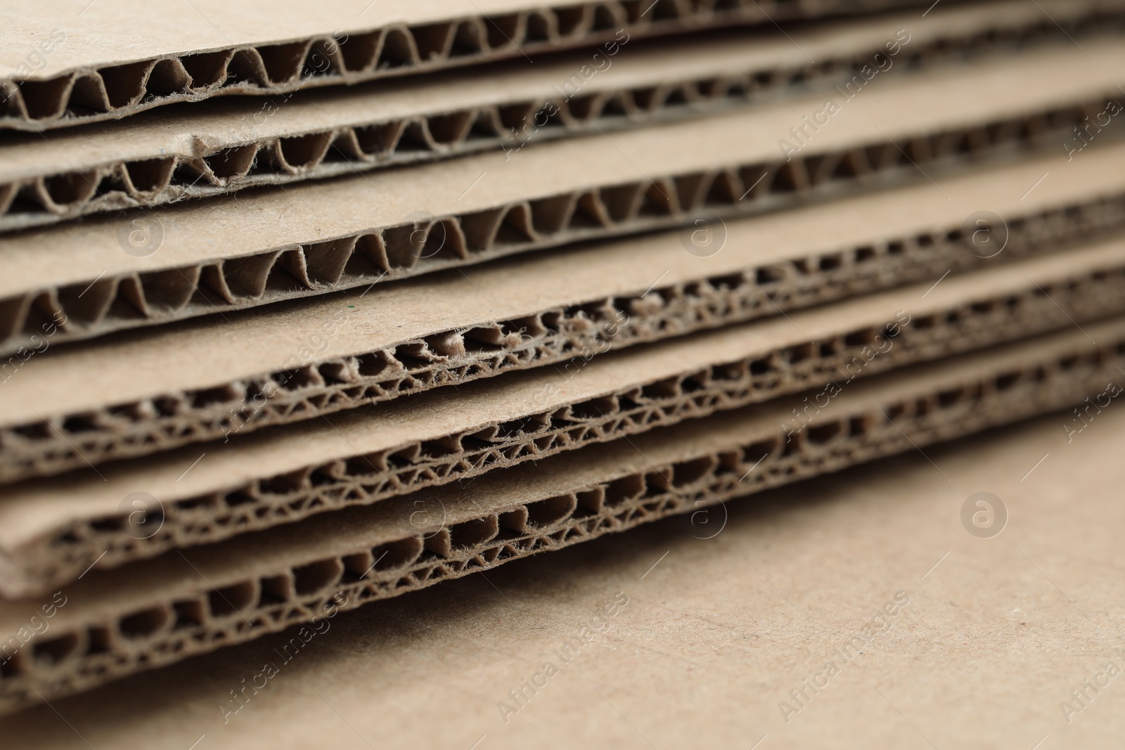 Photo of Sheets of brown corrugated cardboard, closeup view