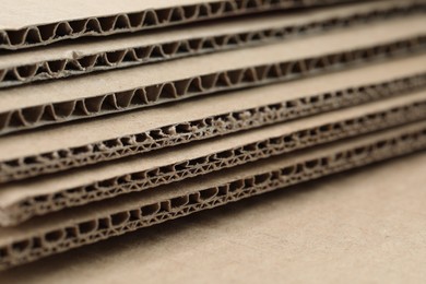 Photo of Sheets of brown corrugated cardboard, closeup view