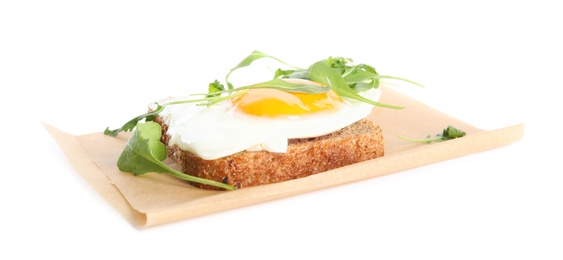 Delicious sandwich with arugula and fried egg isolated on white