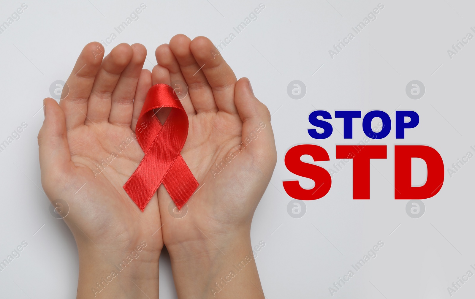 Image of Young woman holding red awareness ribbon on white background, top view. Stop STD 