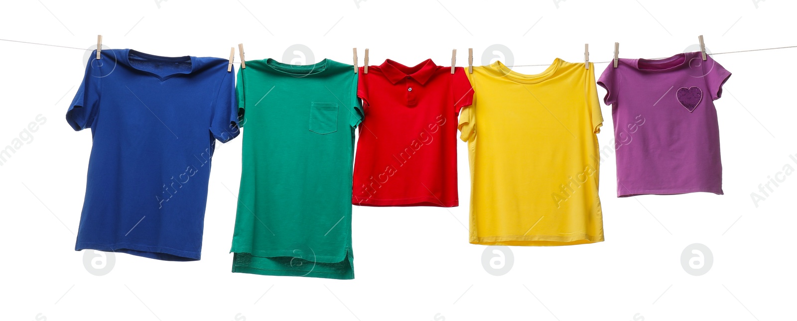 Photo of Colorful t-shirts drying on washing line isolated on white