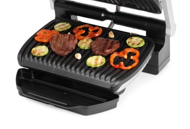 Electric grill with tasty meat and vegetables isolated on white