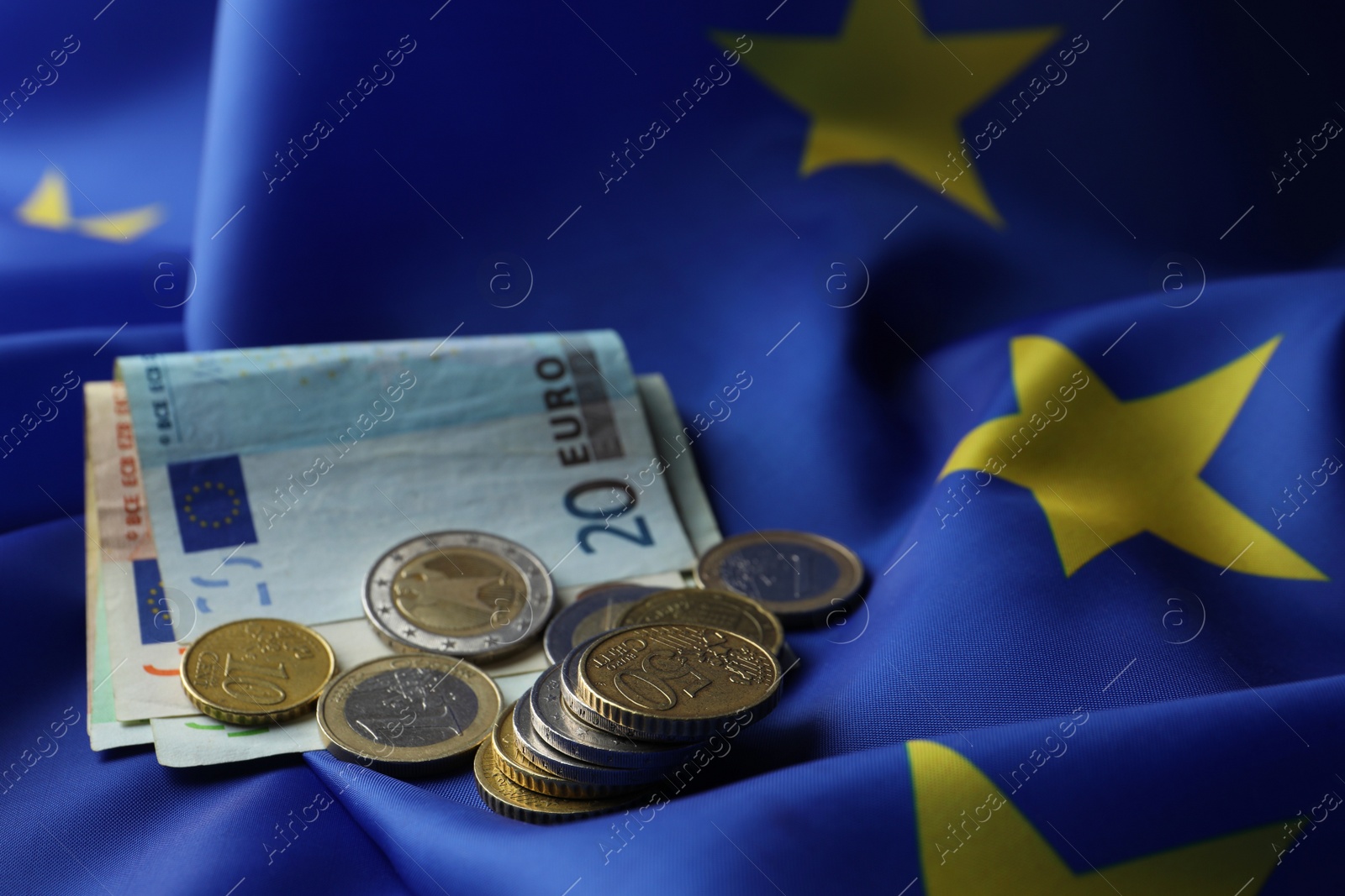 Photo of Coins and banknotes on European Union flag