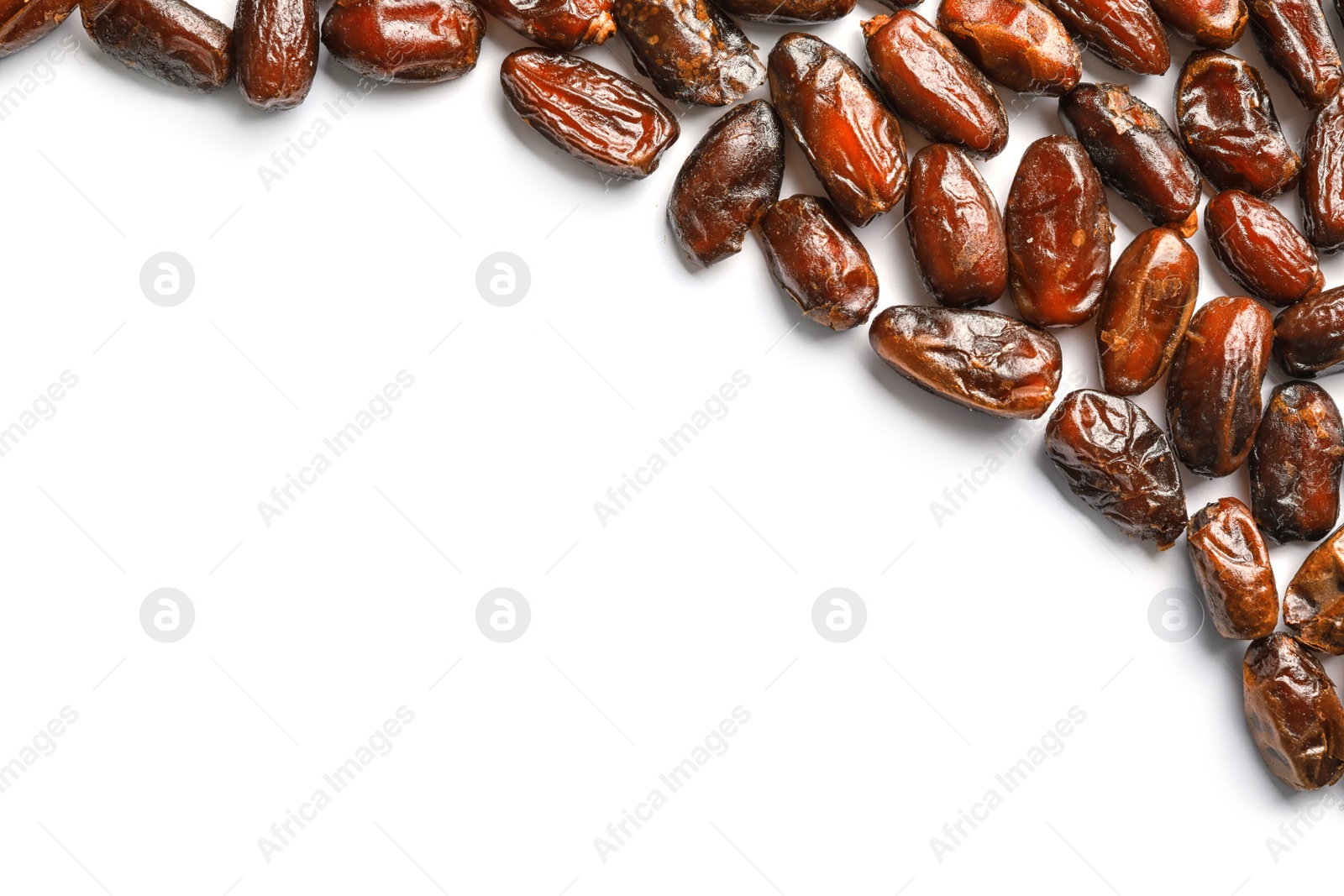 Photo of Frame made of sweet dried date fruits on white background, top view with space for text