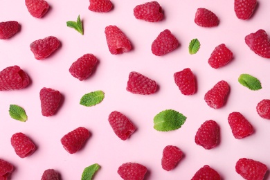 Photo of Flat lay composition with delicious ripe raspberries on pink background