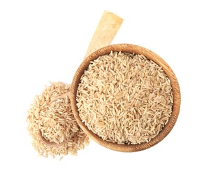 Photo of Bowl and spoon with uncooked brown rice on white background, top view