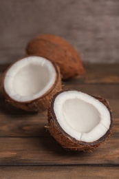 Fresh yummy coconuts on wooden table