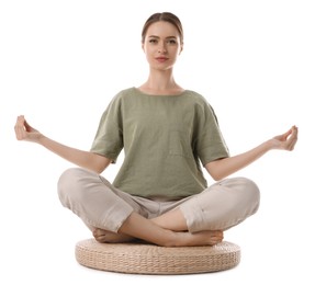 Beautiful young woman meditating on white background