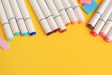 Photo of Different school stationery on yellow background, above view with space for text. Back to school