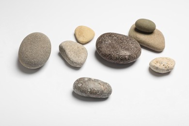 Group of different stones on white background