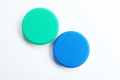 Photo of Bright magnets on white background, top view