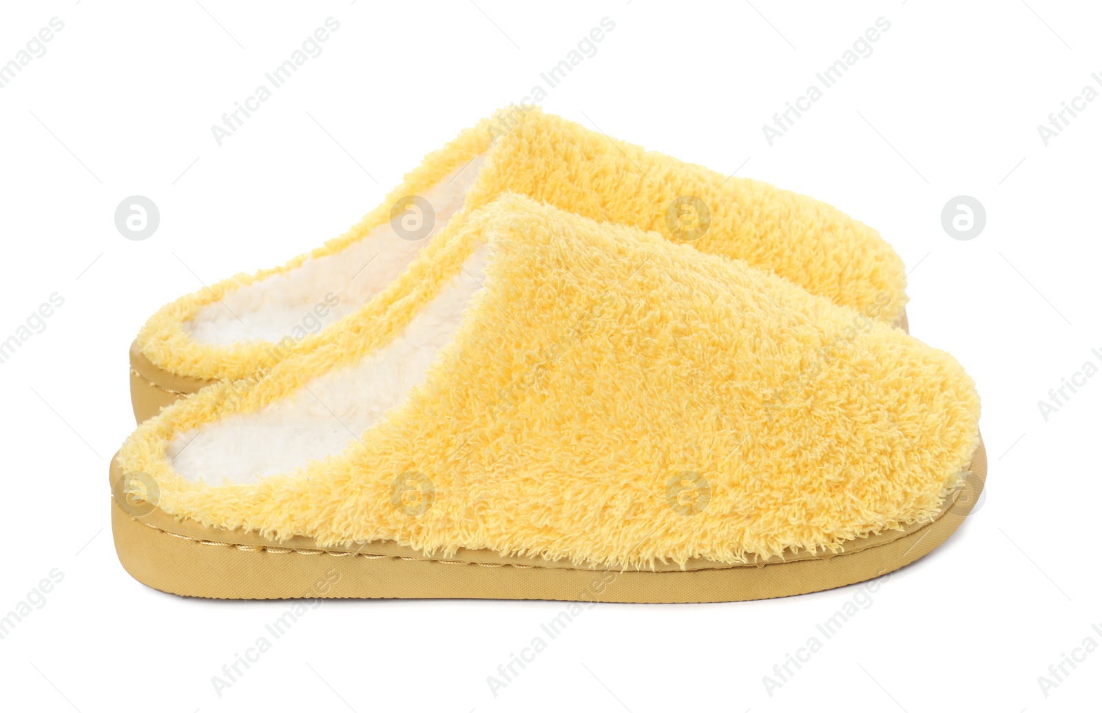 Photo of Pair of yellow soft slippers isolated on white