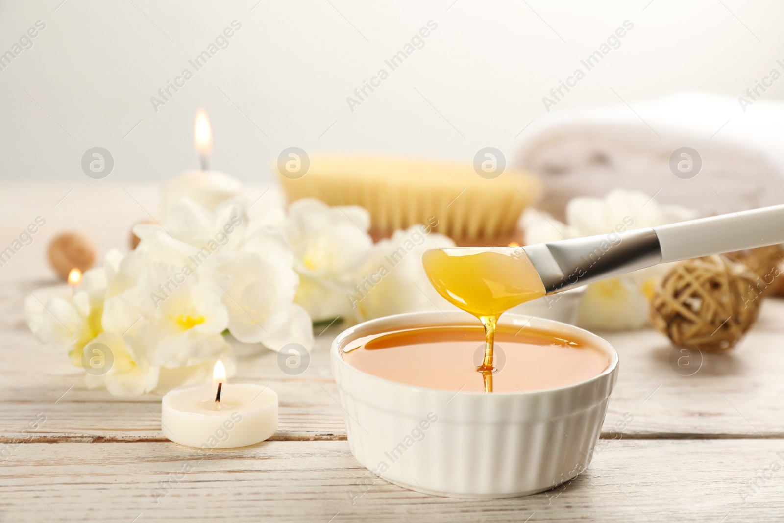Photo of Cosmetic product for spa body wraps on white wooden background