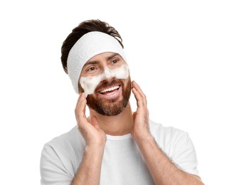 Photo of Man with headband washing his face on white background