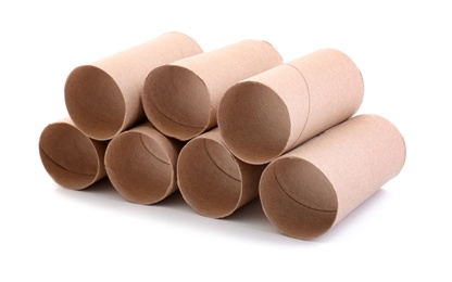 Photo of Stacked empty paper toilet rolls on white background