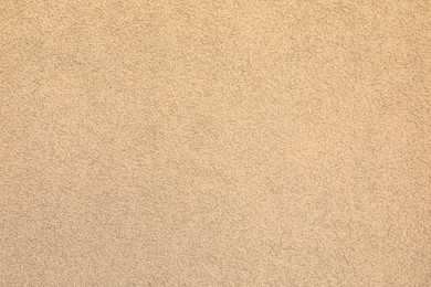 Photo of Texture of beige plaster wall as background