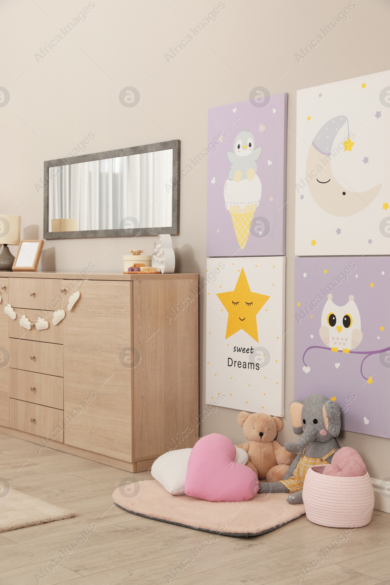 Photo of Baby room interior with toys and stylish furniture