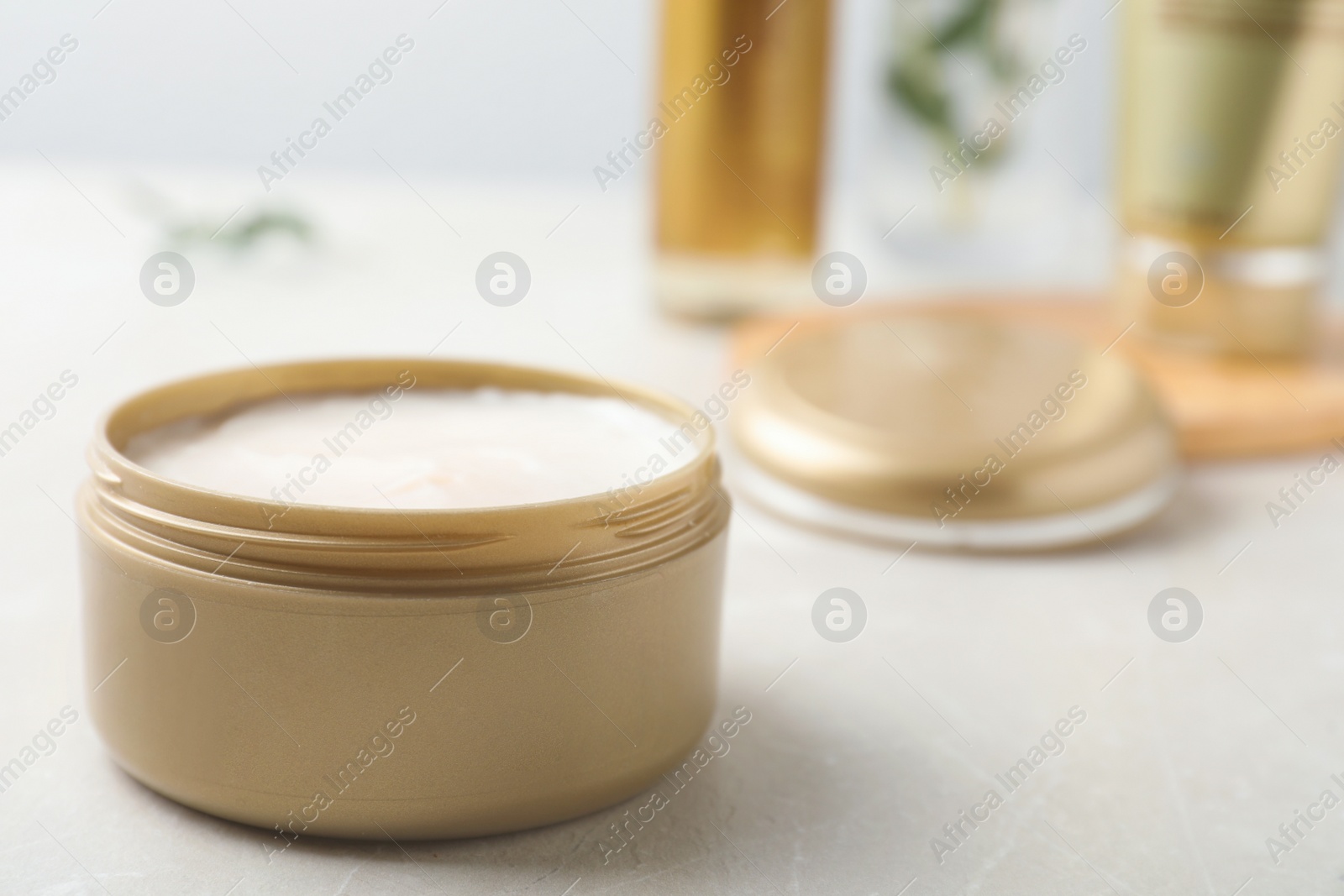 Photo of Jar of cosmetic product on table. Space for text