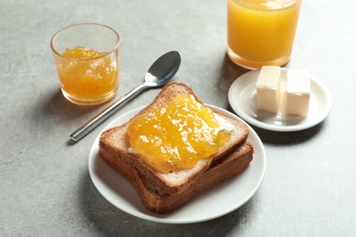 Photo of Toast bread with sweet jam on table
