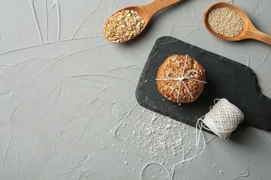 Slate plate with grain cereal cookies on table, top view. Healthy snack