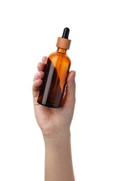 Photo of Woman holding glass bottle with dropper isolated on white, closeup