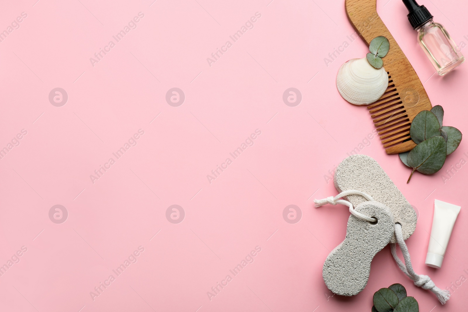 Photo of Flat lay composition with pumice stones on pink background. Space for text