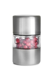 Photo of Grinder with red peppercorns isolated on white