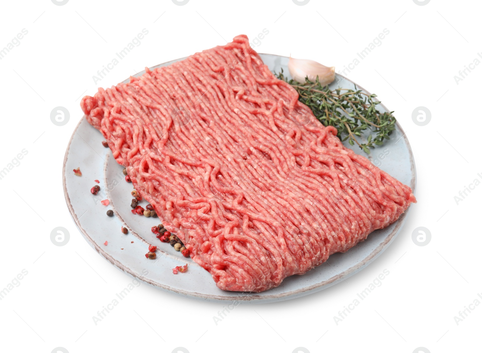 Photo of Fresh raw ground meat, peppercorns, garlic and thyme isolated on white