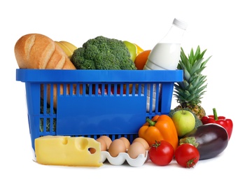 Shopping basket and grocery products on white background