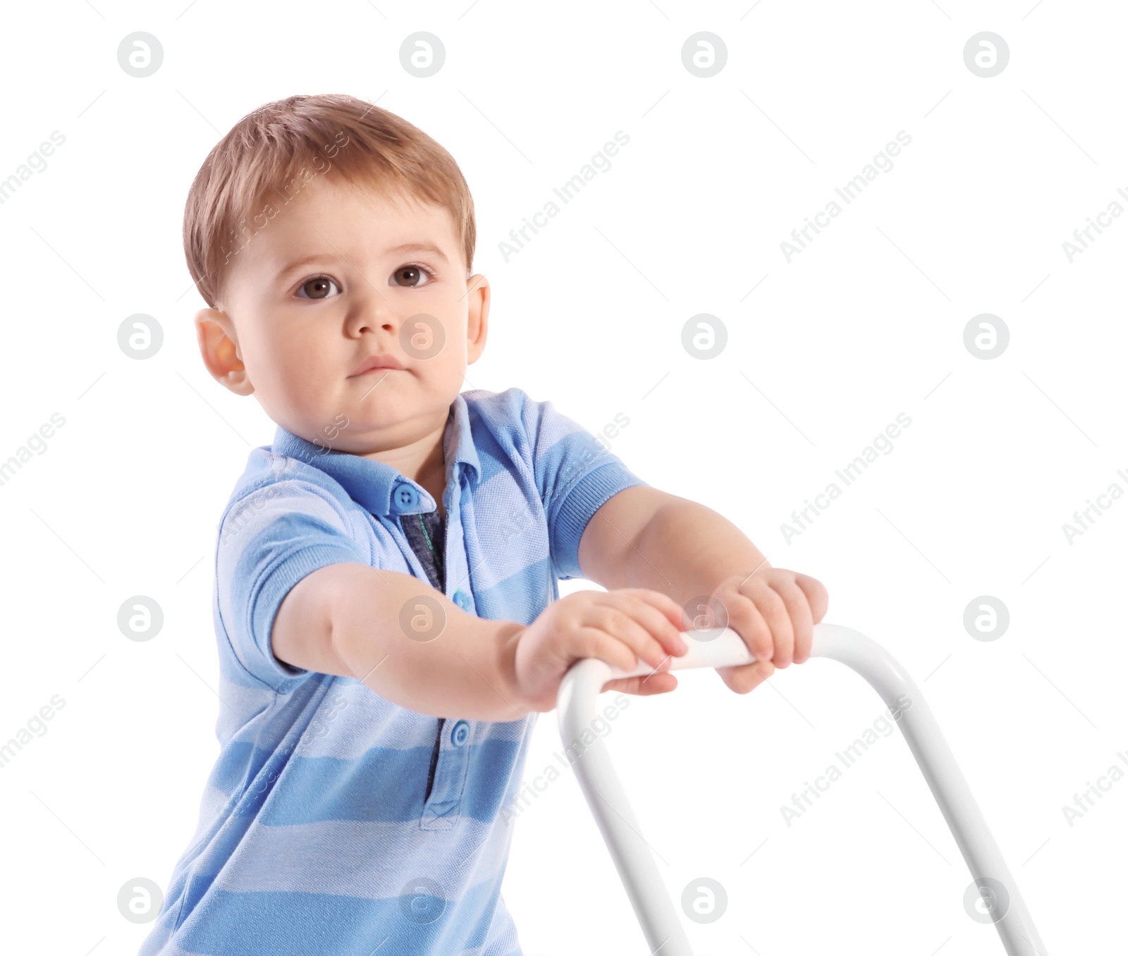 Photo of Cute baby playing with toy walker on white background