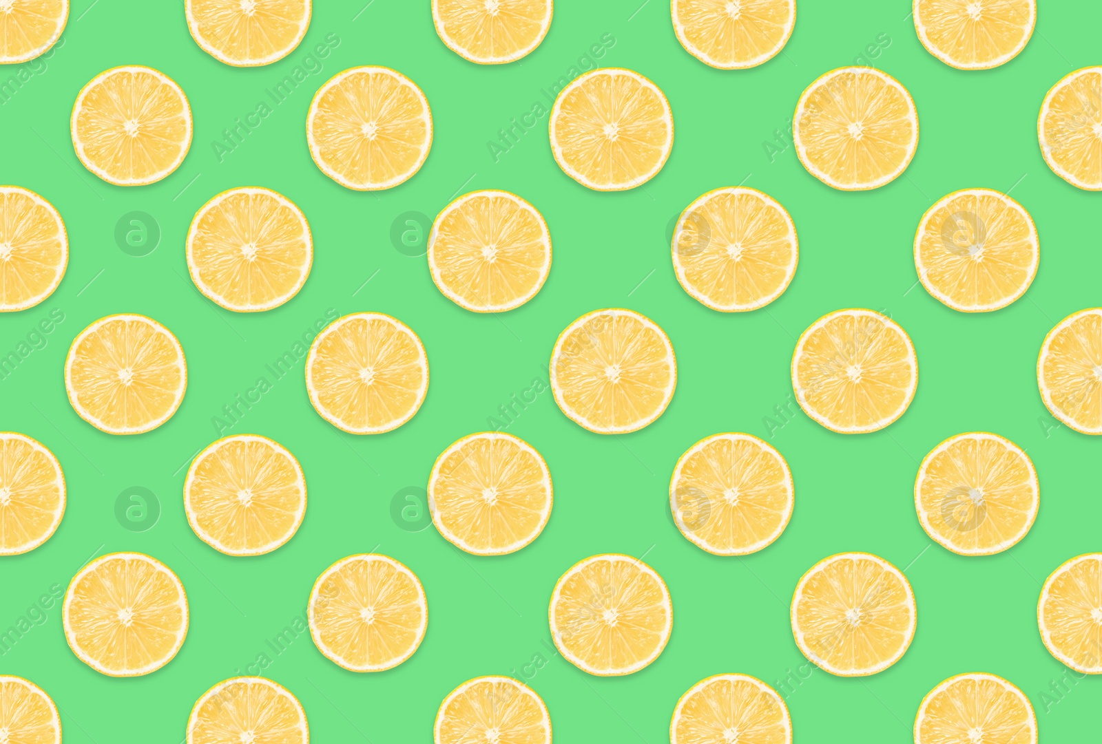 Image of Pattern of lemon slices on light green background