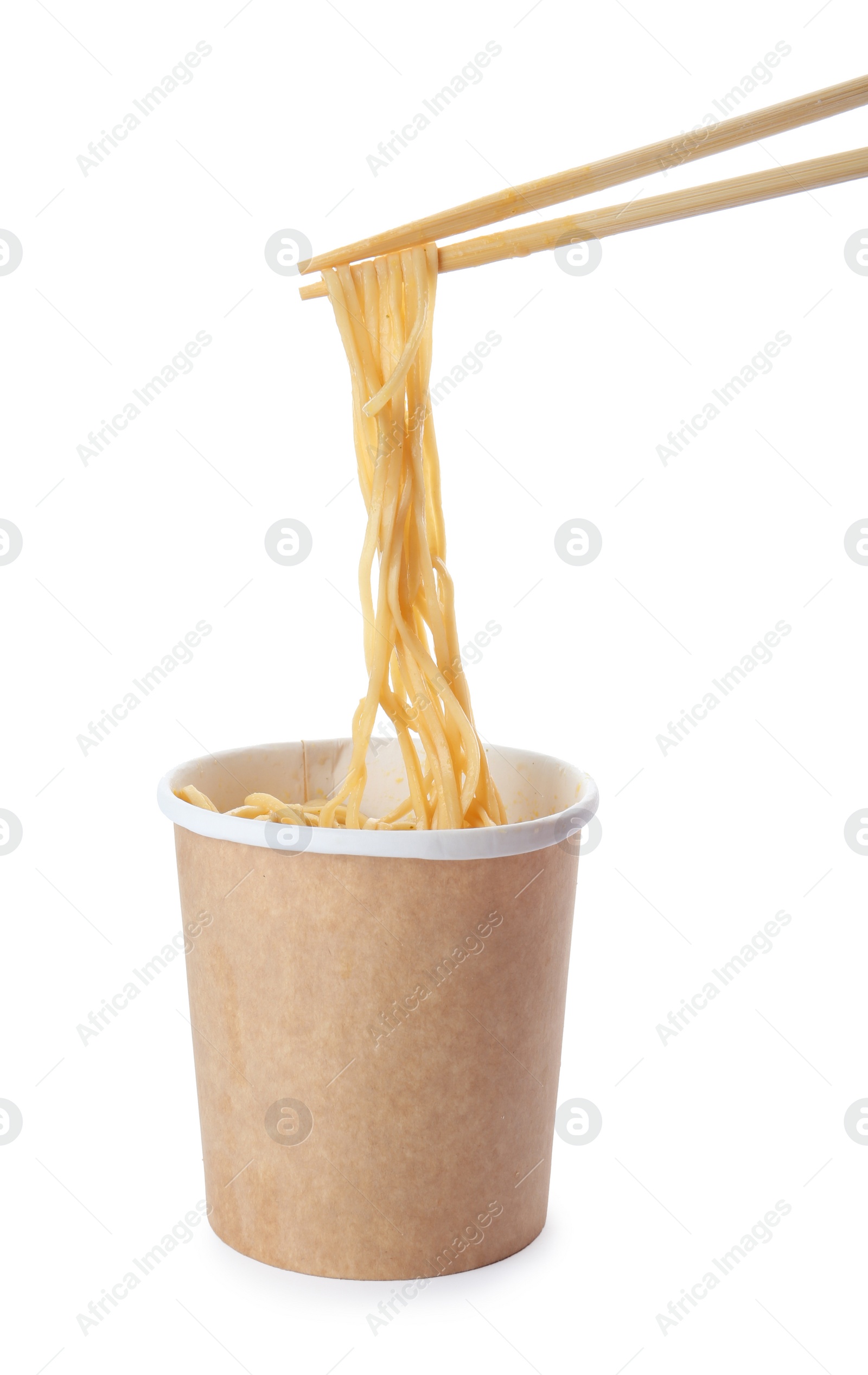 Photo of Paper cup of instant noodles and chopsticks isolated on white. Mockup for design