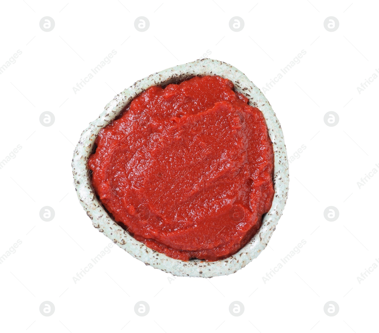 Photo of Bowl of tasty tomato paste isolated on white, top view