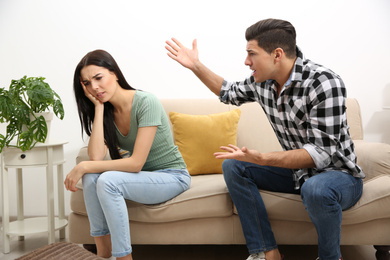 Photo of Couple having quarrel at home. Relationship problems