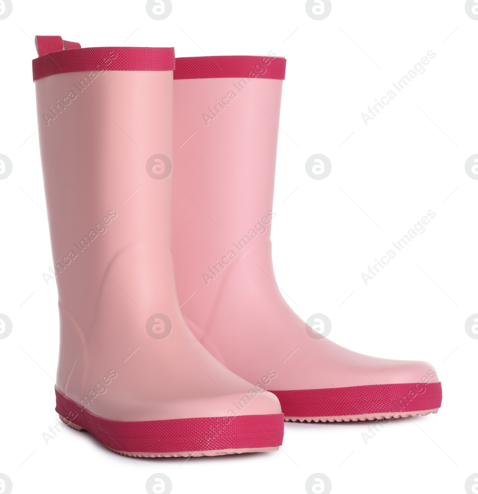 Photo of Modern pink rubber boots isolated on white