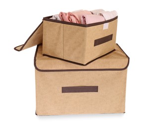 Photo of Textile storage cases with folded clothes on white background